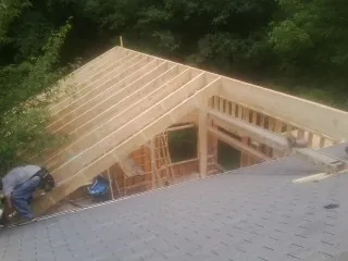 Framing a new roof addition that ties into an existing shingle roof in Du Bois